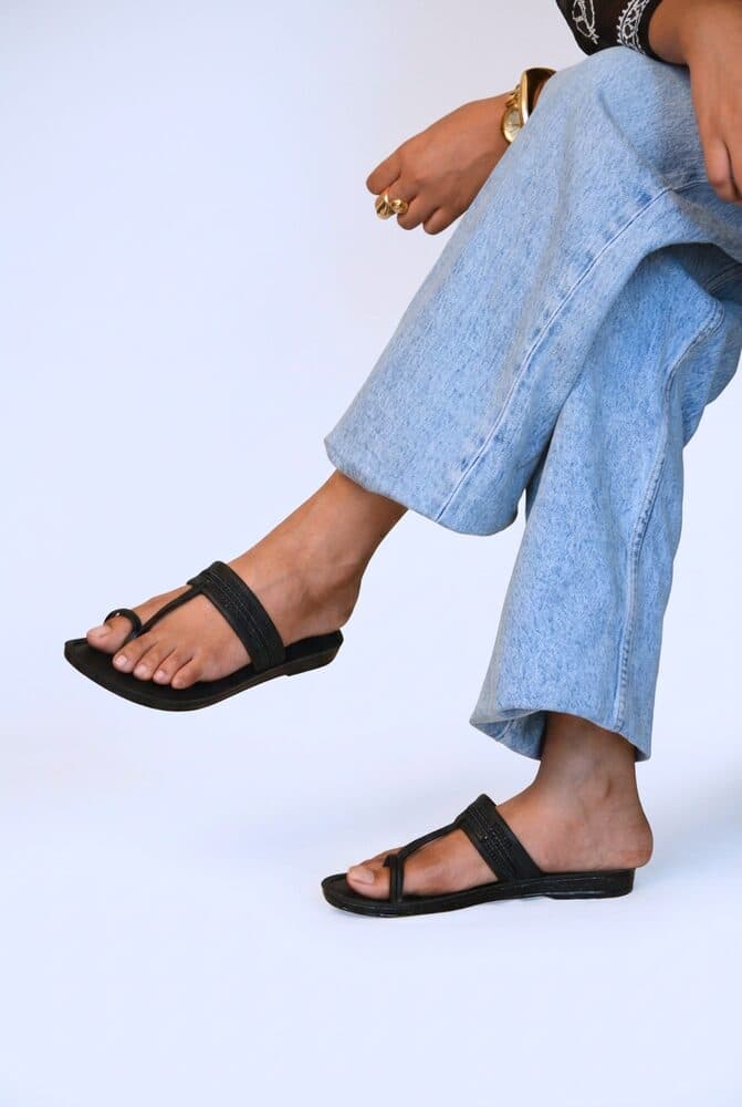 Black toe-ring flat sandal with braided strap detail