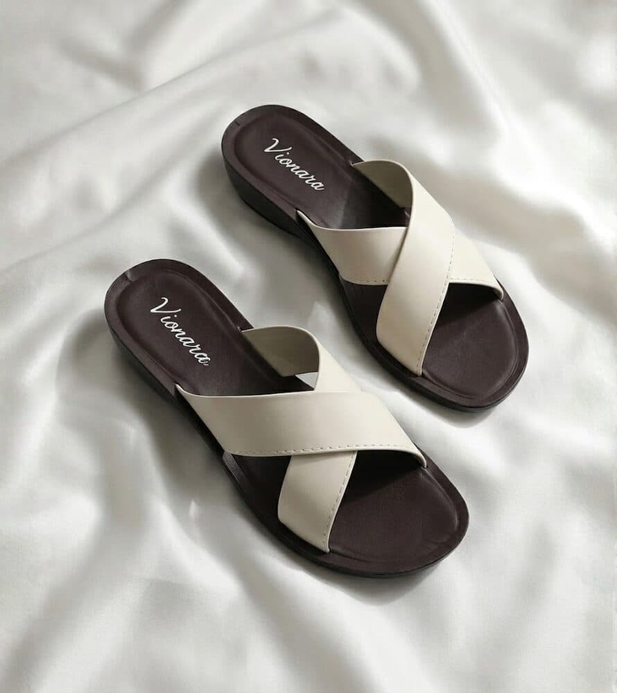 Ivory crisscross flat slide sandal with brown sole