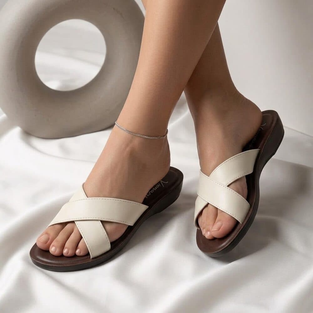 Ivory crisscross flat slide sandal with brown sole