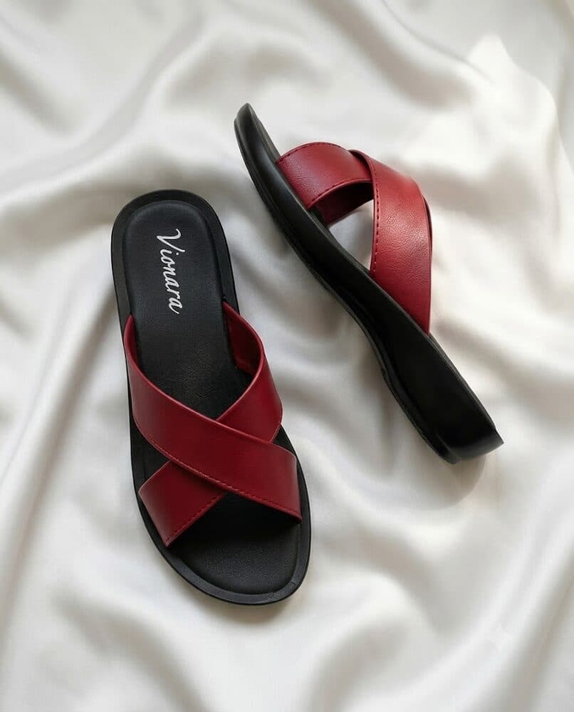 Red crisscross flat slide sandal with black sole