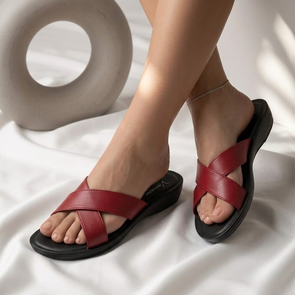 Red crisscross flat slide sandal with black sole